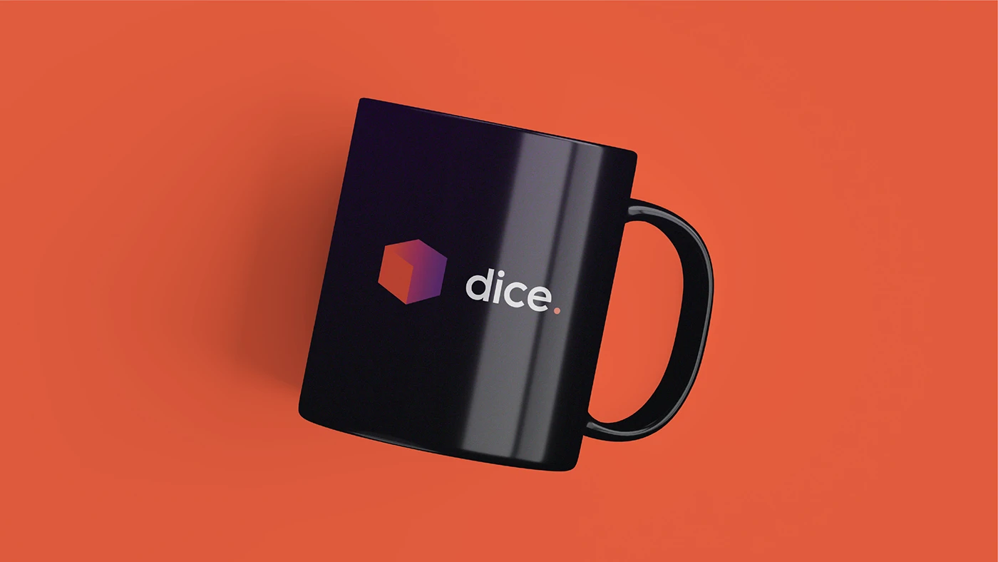 Black Dice branded mug on an orange background
