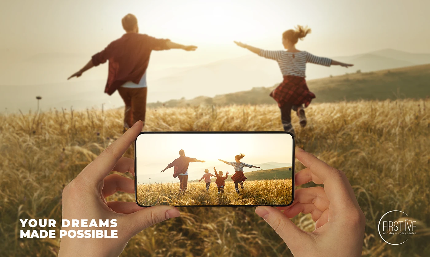 Outdoor IVF campaign lifestyle scene framed through a phone